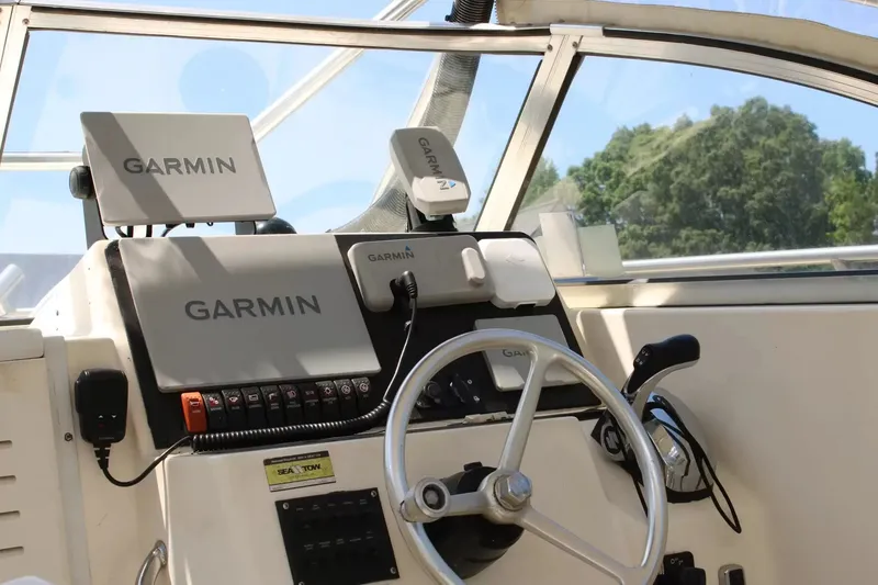 Slide: The Image of 2002 Sea Pro 235WA helm with Garmin navigation equipment. - 7