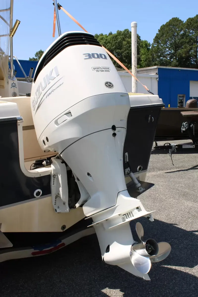 Slide: The Image of Suzuki 300 HP outboard motor on a 2002 Sea Pro 235WA boat. - 8