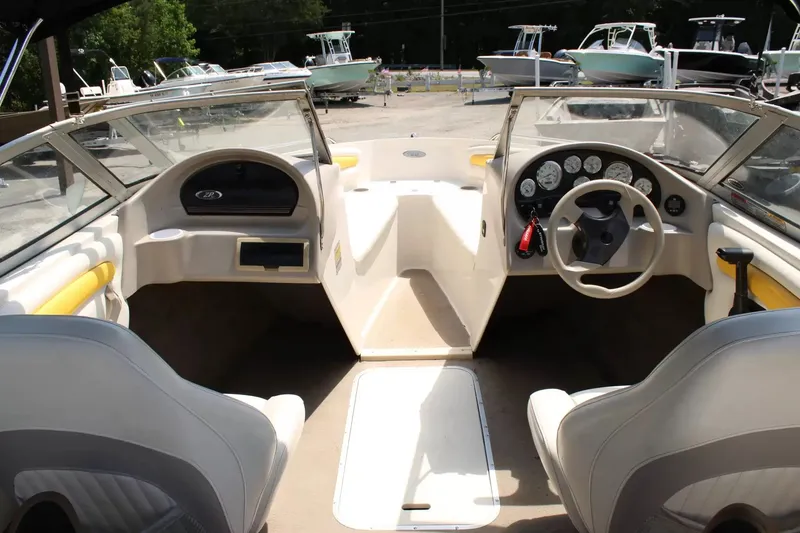 Slide: The Image of Interior of a 2004 Stingray 180 LX boat with steering console. - 10