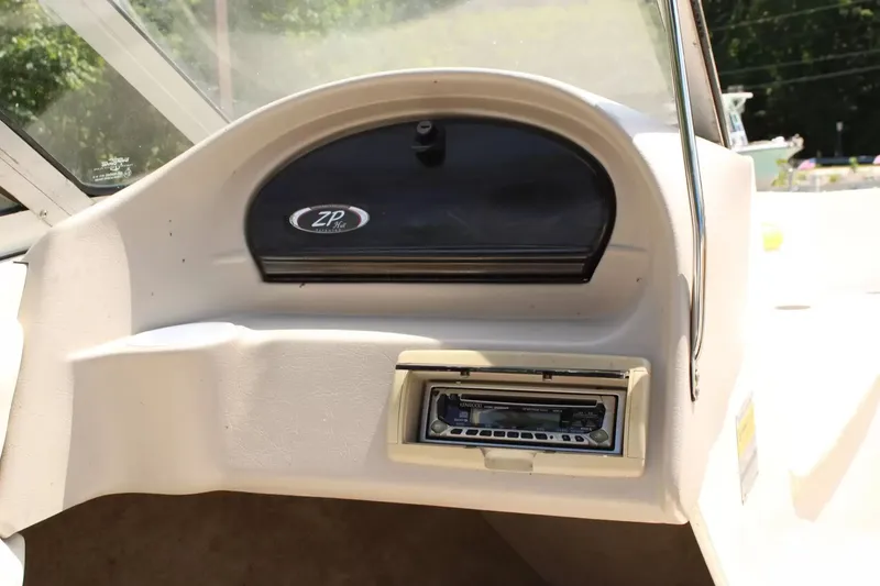 Slide: The Image of Dashboard of a 2004 Stingray 180 LX boat with stereo system. - 13