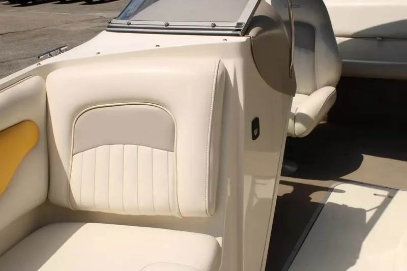 Slide: The Image of Interior of a 2004 Stingray 180 LX boat with beige seating. - 18