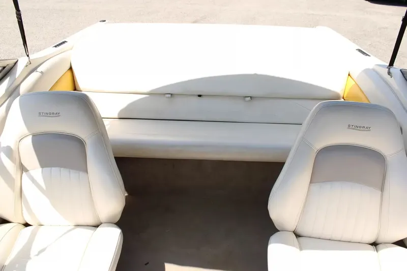 Slide: The Image of Interior of a 2004 Stingray 180 LX boat with white seats. - 19