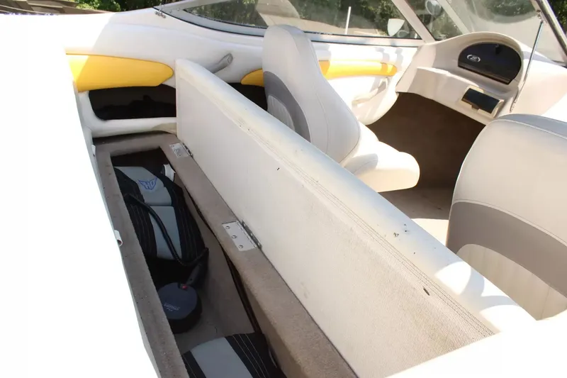 Slide: The Image of Interior of a 2004 Stingray 180 LX boat with storage compartment. - 20