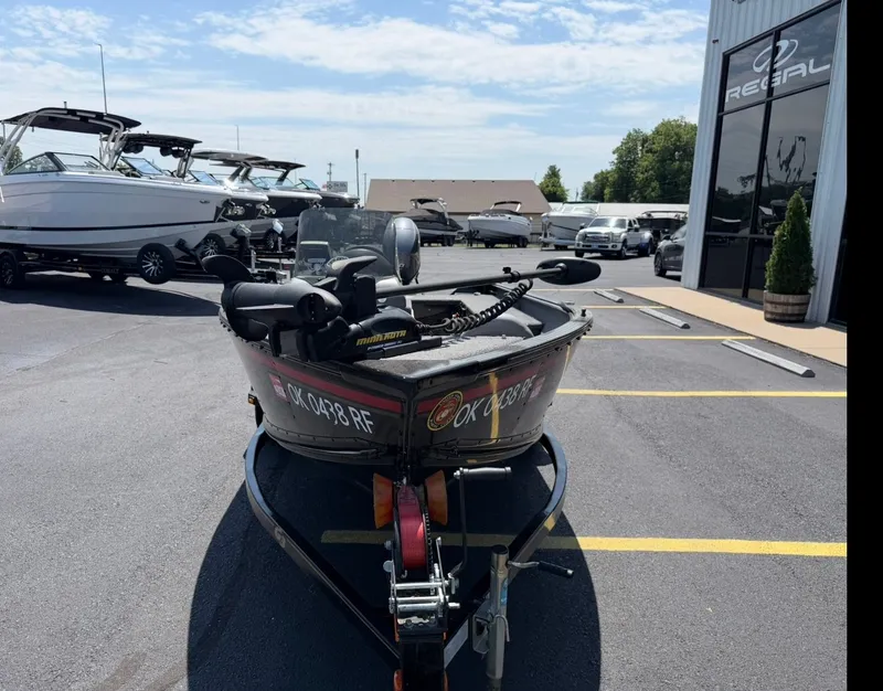 Slide: The Image of 2012 G3 V167 boat on trailer in front of Regal building. - 3