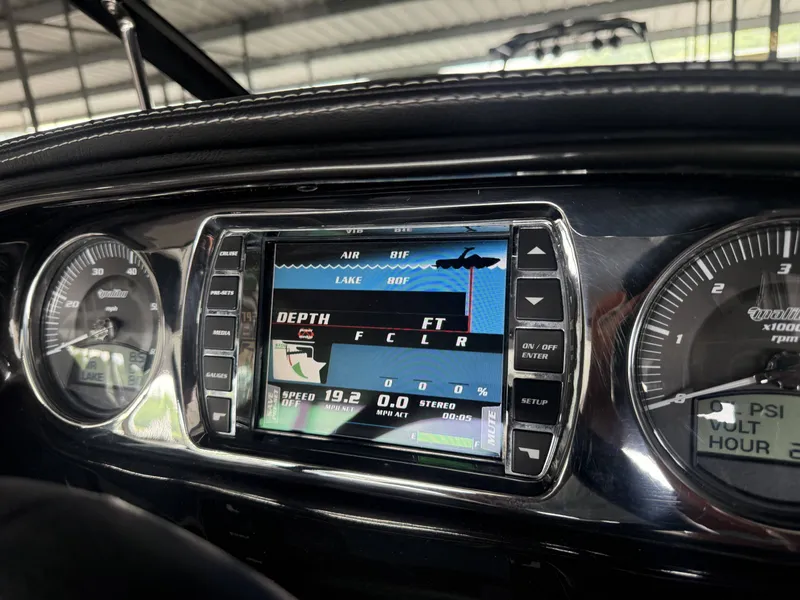 Slide: The Image of Dashboard of a 2012 Malibu Wakesetter 23 LSV with digital display. - 21