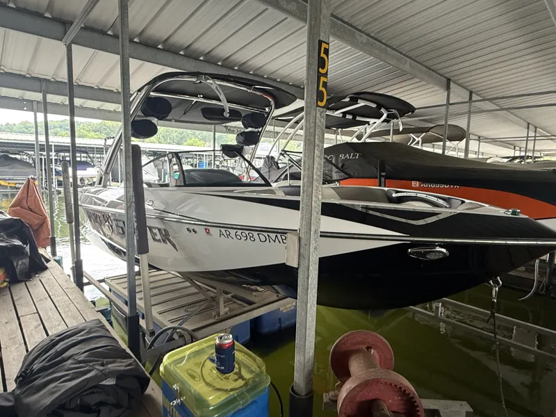 Slide: The Image of 2012 Malibu Wakesetter 23 LSV in covered boat slip. - 3