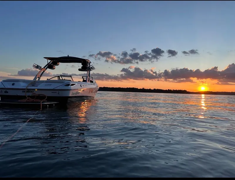 Slide: The Image of 2012 Malibu Wakesetter 23 LSV on water at sunset. - 31