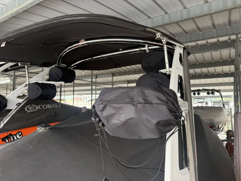 Slide: The Image of 2012 Malibu Wakesetter 23 LSV covered in storage facility. - 34