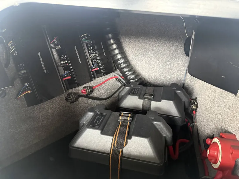 Slide: The Image of 2012 Malibu Wakesetter 23 LSV electrical system with batteries and amplifiers. - 35