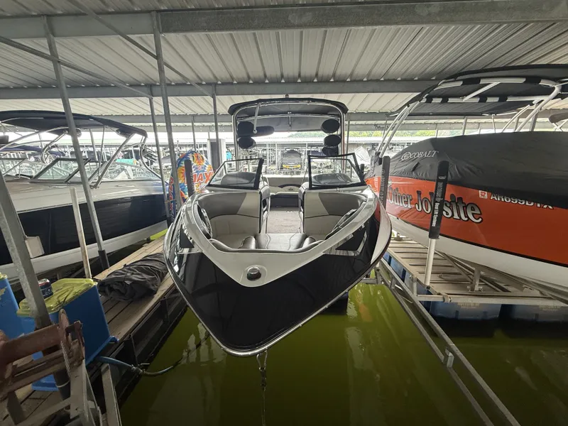 Slide: The Image of 2012 Malibu Wakesetter 23 LSV in a covered boat dock. - 4