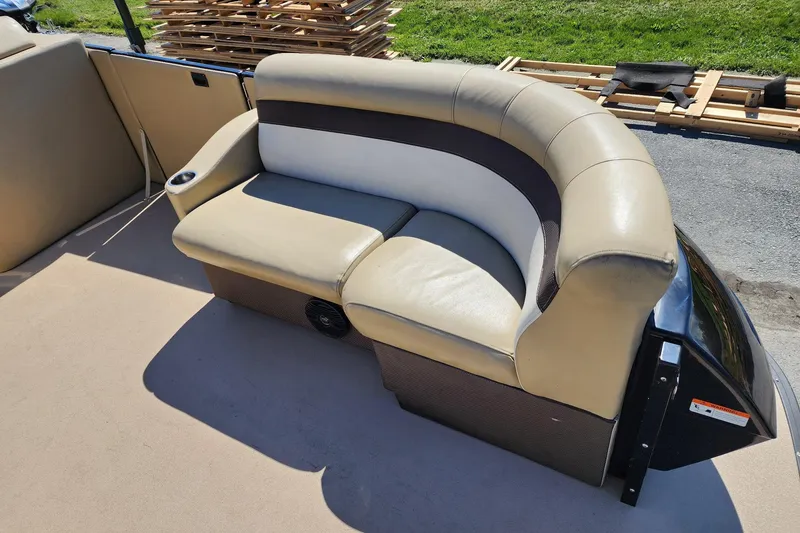 Slide: The Image of 2017 Larson Escape RT 2400 Cruise Triple boat seating, beige and brown upholstery. - 14