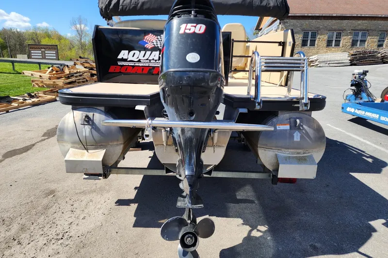 Slide: The Image of 2017 Larson Escape RT 2400 Cruise Triple pontoon boat with 150 HP outboard motor. - 6