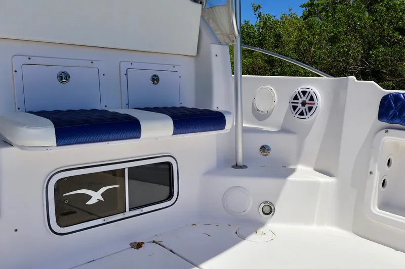 Slide: The Image of Interior of 2002 Pro-Line 32 Express boat with seating and storage compartments. - 6