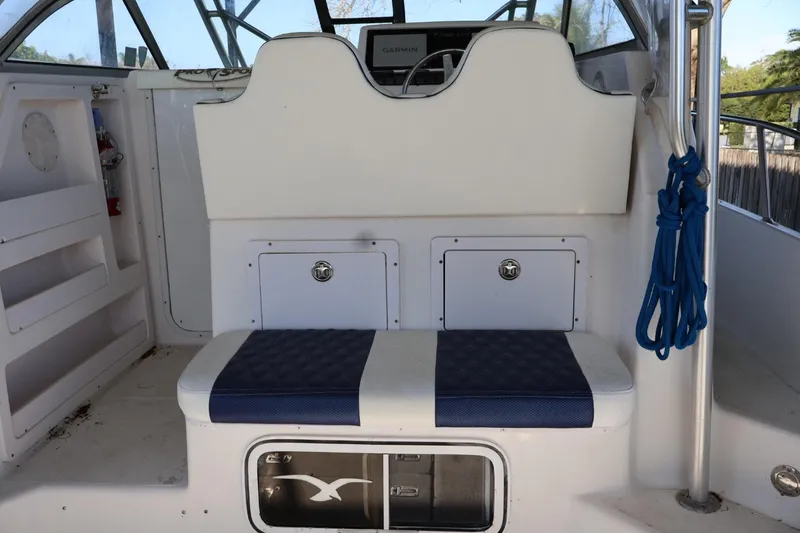 Slide: The Image of 2002 Pro-Line 32 Express boat interior with seating and storage compartments. - 7