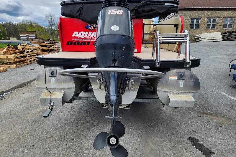 Slide: The Image of 2017 Larson Escape RT 2400 Cruise Triple pontoon boat with powerful outboard motor. - 8