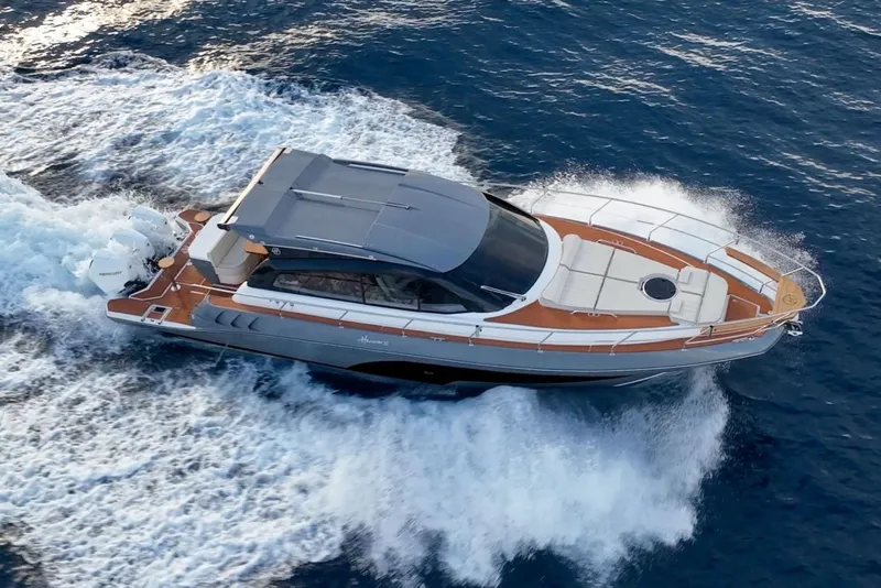 Slide: The Image of Manufacturer Provided Image: Luxury Hanover 415 yacht cruising on open sea, 2025 model. - 1
