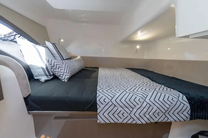 Slide: The Image of Manufacturer Provided Image: Luxurious interior cabin of 2025 Hanover 415 yacht with modern bedding and ambient lighting. - 11