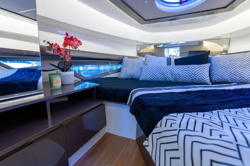Slide: The Image of Manufacturer Provided Image: Luxurious interior of 2025 Hanover 415 yacht with elegant bedding and decor. - 12