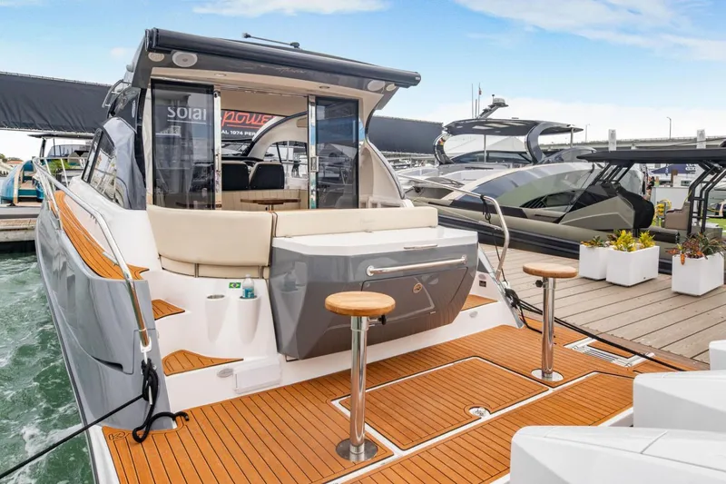 Slide: The Image of Manufacturer Provided Image: Luxury Hanover 415 yacht, 2025 model, docked with elegant teak deck and modern design. - 16