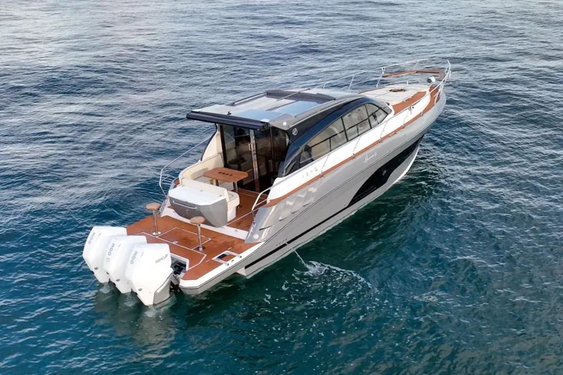 Slide: The Image of Manufacturer Provided Image: 2025 Hanover 415 luxury yacht cruising on open water, featuring sleek design and powerful engines. - 2