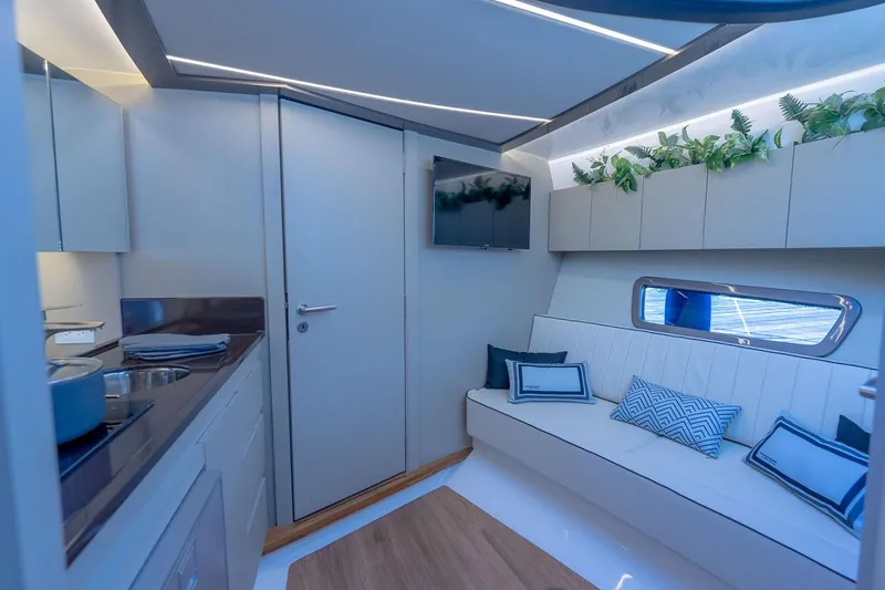Slide: The Image of Manufacturer Provided Image: Luxurious interior of 2025 Hanover 415 yacht with modern design and comfortable seating. - 8