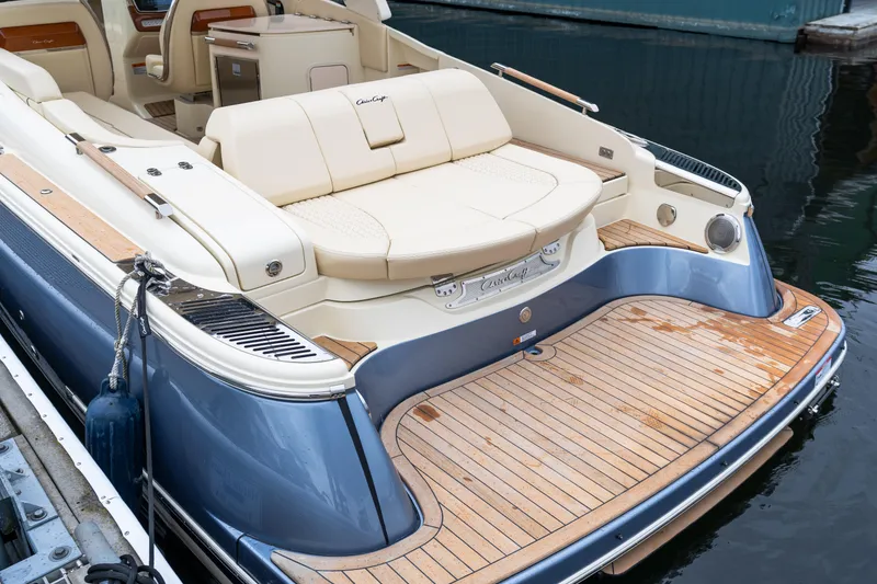 Slide: The Image of 2025 Chris-Craft Launch 31 GT luxury boat with elegant seating and teak deck. - 13