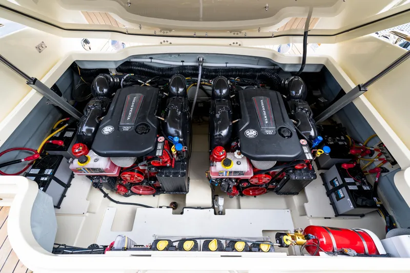Slide: The Image of Engine compartment of 2025 Chris-Craft Launch 31 GT, featuring dual Volvo Penta engines. - 14