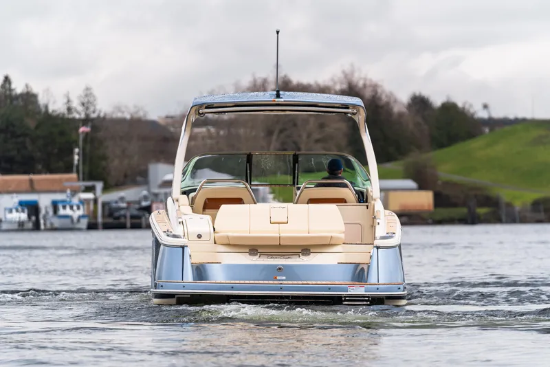 Slide: The Image of 2025 Chris-Craft Launch 31 GT cruising on a scenic waterway. - 3