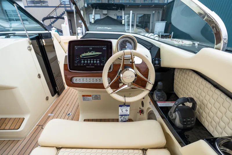 Slide: The Image of Luxurious 2025 Chris-Craft Launch 31 GT boat interior with advanced dashboard and steering wheel. - 7