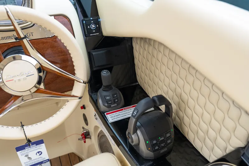 Slide: The Image of 2025 Chris-Craft Launch 31 GT interior with steering wheel and control panel details. - 8