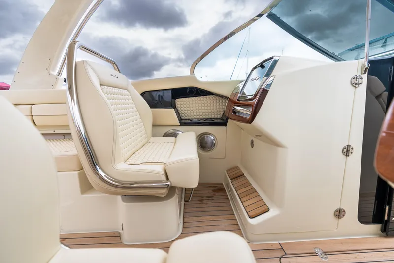 Slide: The Image of 2025 Chris-Craft Launch 31 GT interior with luxurious seating and elegant dashboard design. - 9