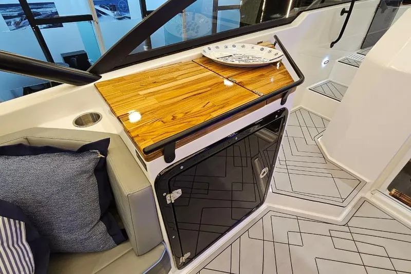 Slide: The Image of Luxurious interior of 2027 Hanover 327 boat with sleek wood finish and modern design. - 24