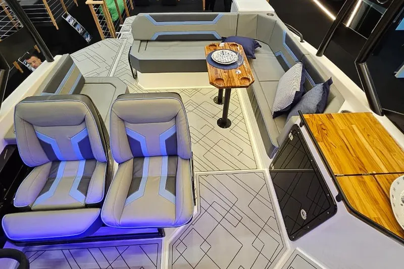Slide: The Image of Luxurious interior of 2027 Hanover 327 boat with modern seating and wooden accents. - 27