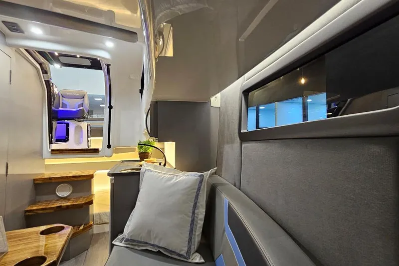 Slide: The Image of Luxurious interior of 2027 Hanover 327 RV with modern seating and ambient lighting. - 29