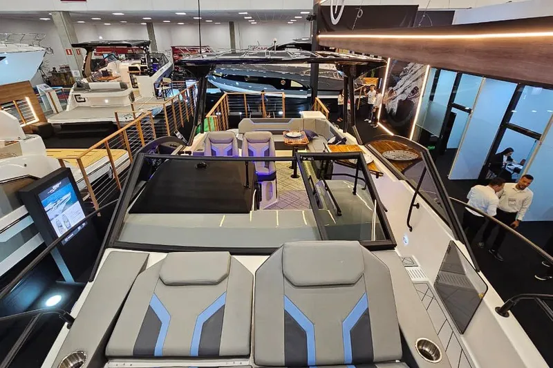 Slide: The Image of Modern Hanover 327 yacht interior at a boat show, showcasing luxury seating and design, 2027 model. - 35