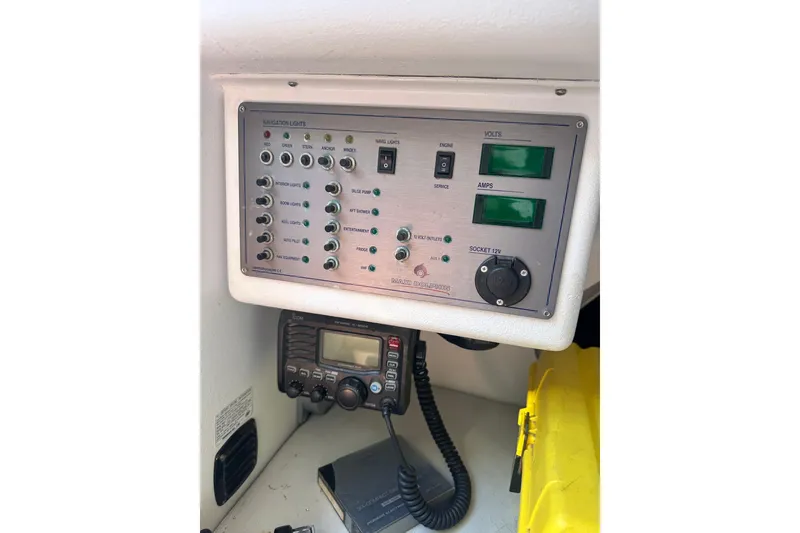 Slide: The Image of Control panel of a 2006 Maxi Dolphin Cross Current 33 sailboat, featuring navigation and electrical systems. - 13