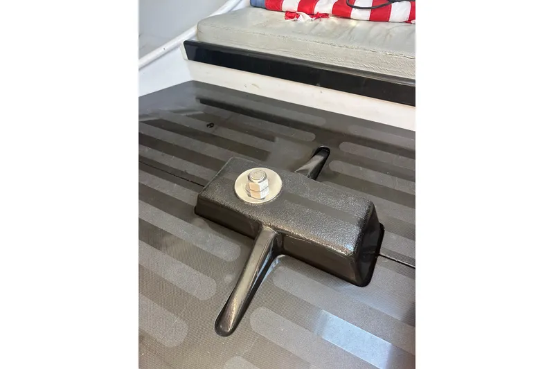 Slide: The Image of Interior detail of a 2006 Maxi Dolphin Cross Current 33 sailboat, featuring a secure bolt fixture. - 14