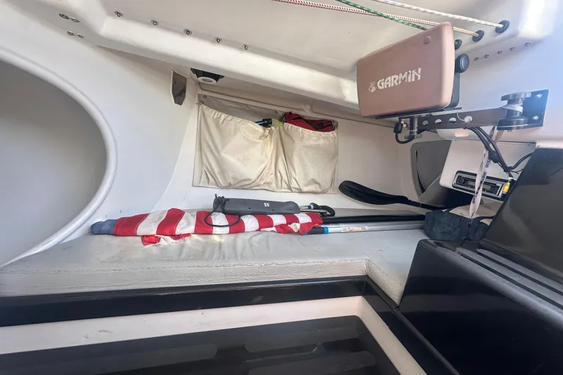 Slide: The Image of Interior of 2006 Maxi Dolphin Cross Current 33 sailboat with navigation equipment and storage. - 15
