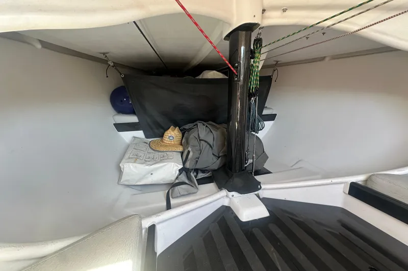 Slide: The Image of Interior of 2006 Maxi Dolphin Cross Current 33 sailboat with gear and hat. - 16