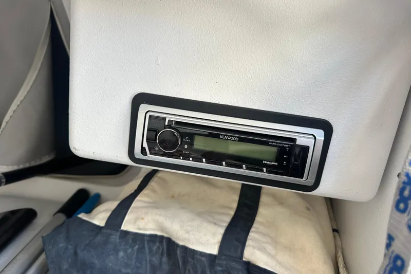 Slide: The Image of Kenwood stereo system in a 2006 Maxi Dolphin Cross Current 33 yacht interior. - 19