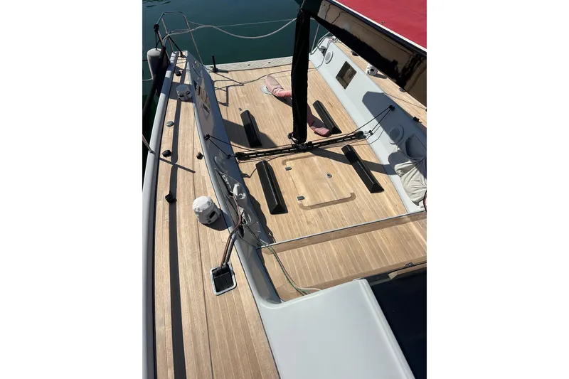 Slide: The Image of Maxi Dolphin Cross Current 33 sailboat deck, 2006 model, featuring sleek wooden finish. - 21