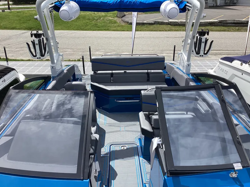 Slide: The Image of Interior of 2026 Cobalt R4 Surf with modern seating and blue trim. - 7