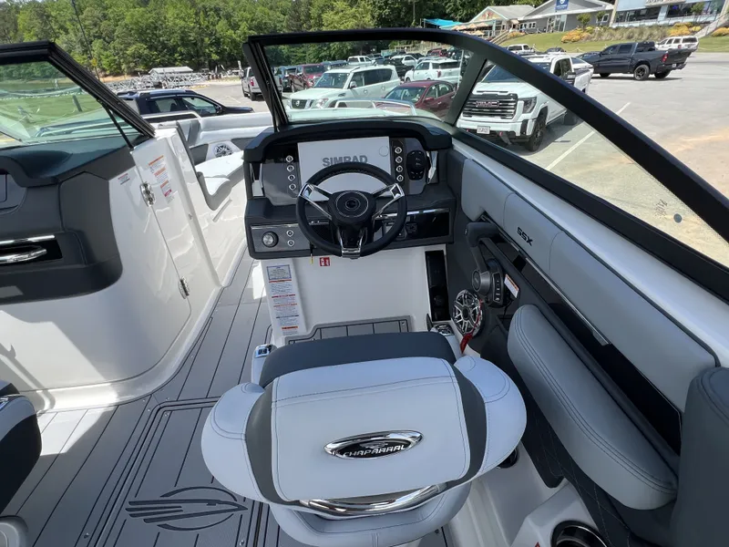 Slide: The Image of Interior of 2026 Chaparral SSX 6 boat with modern helm console. - 10