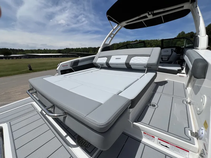 Slide: The Image of 2026 Chaparral SSX 6 boat with luxurious sun deck and sleek design. - 4
