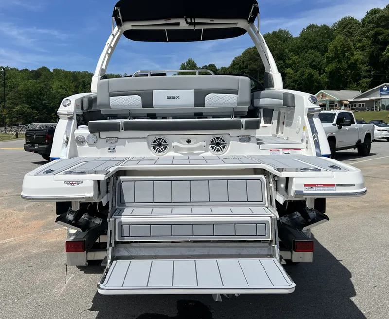 Slide: The Image of Rear view of 2026 Chaparral SSX 6 boat with open swim platform. - 8
