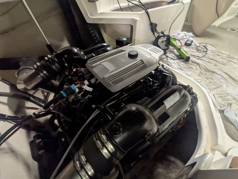 Slide: The Image of Engine compartment of a 2013 Hurricane SD2200-IO boat with visible engine. - 3