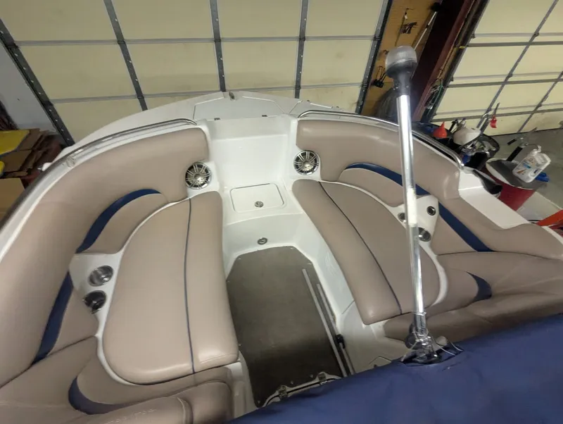 Slide: The Image of Interior of a 2013 Hurricane SD2200-IO boat with beige seating. - 4