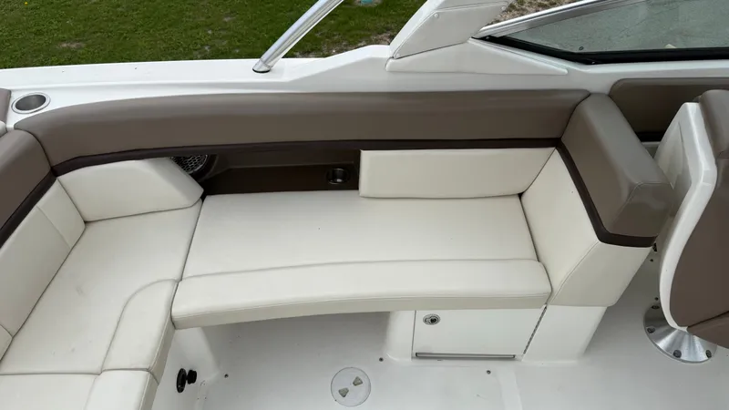 Slide: The Image of Interior of a 2013 Sea Ray 270 SLX with beige upholstery. - 10