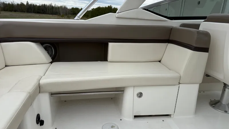 Slide: The Image of Interior of 2013 Sea Ray 270 SLX with beige seating. - 11