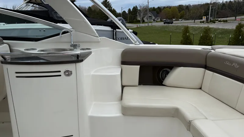 Slide: The Image of Interior of a 2013 Sea Ray 270 SLX with seating and sink. - 13